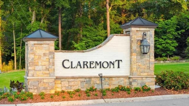 Stone monument sign at the gated entrance to the Claremont community in Greenville, SC.